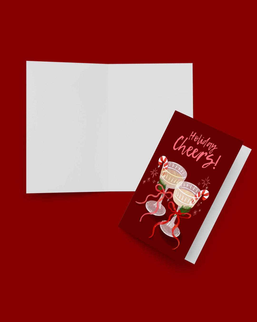 Greeting card with 'Mistletoe Cheers!' text and Christmas-themed design on a red background