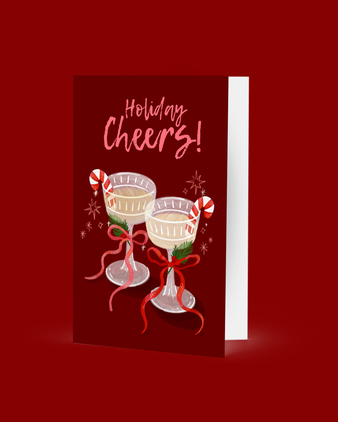 Greeting card with 'Holiday Cheers!' text and festive cocktails on a red background