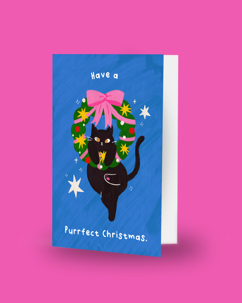 Have a Purrfect Christmas card standing upright showing front cover and envelope edge