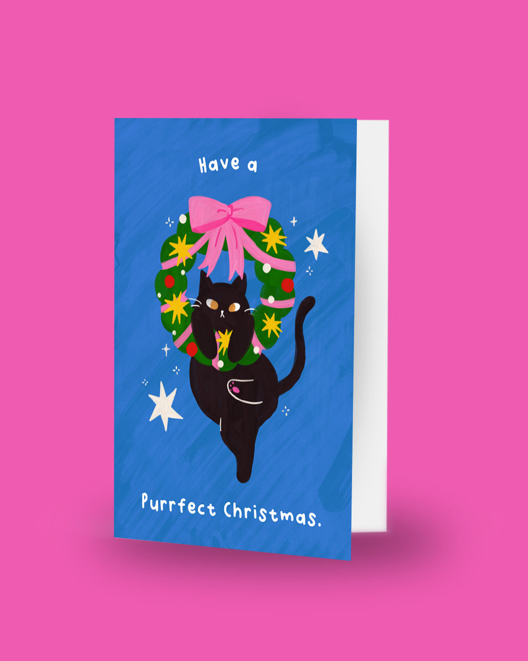 Have a Purrfect Christmas card standing upright showing front cover and envelope edge