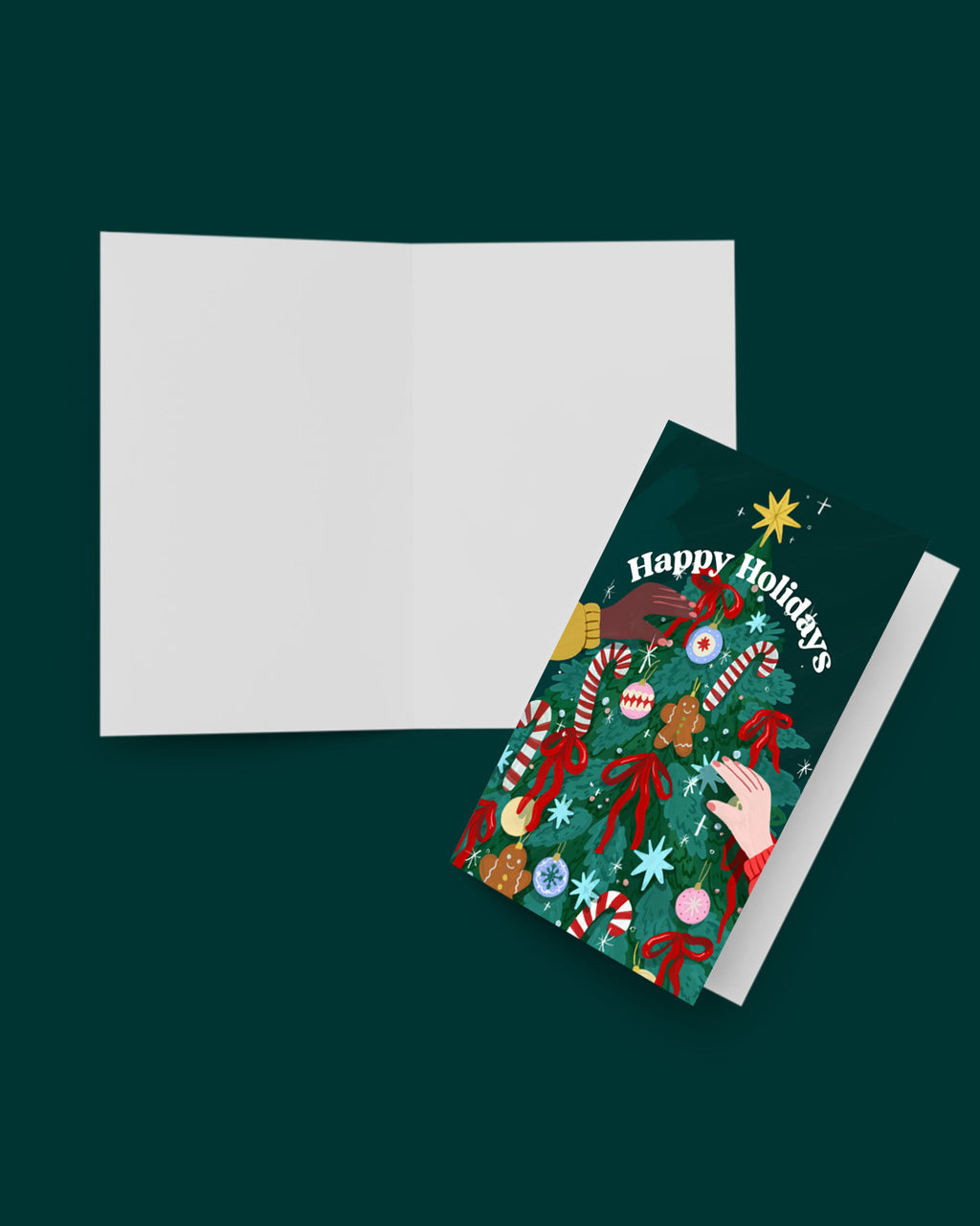 Greeting card with festive design and envelope on a dark green background