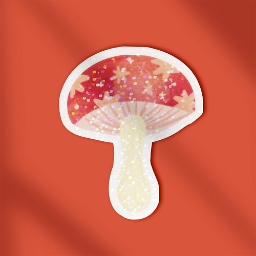Mushroom-shaped object with a red cap and white stem on an orange background