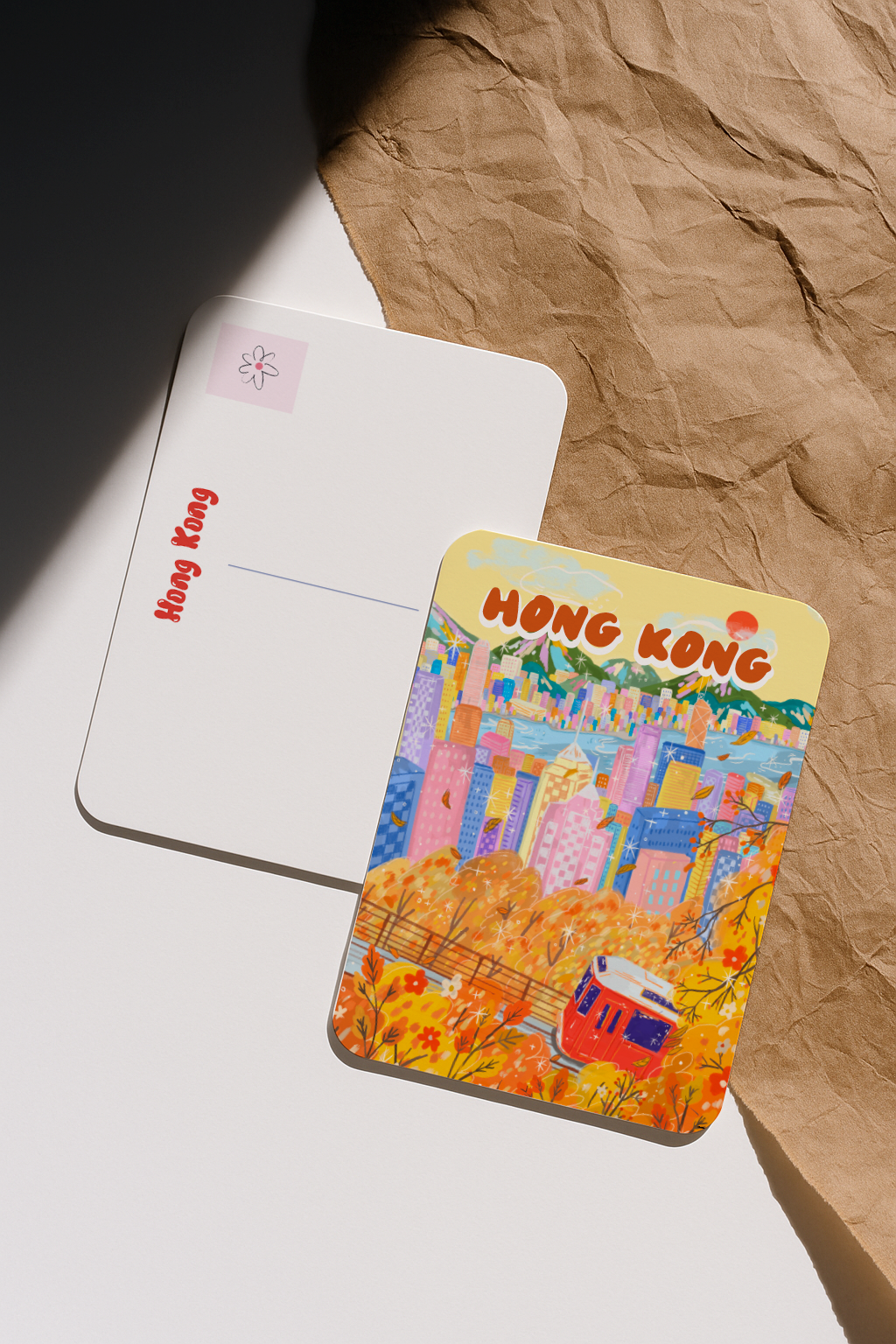 Colorful Hong Kong-themed card on a textured surface