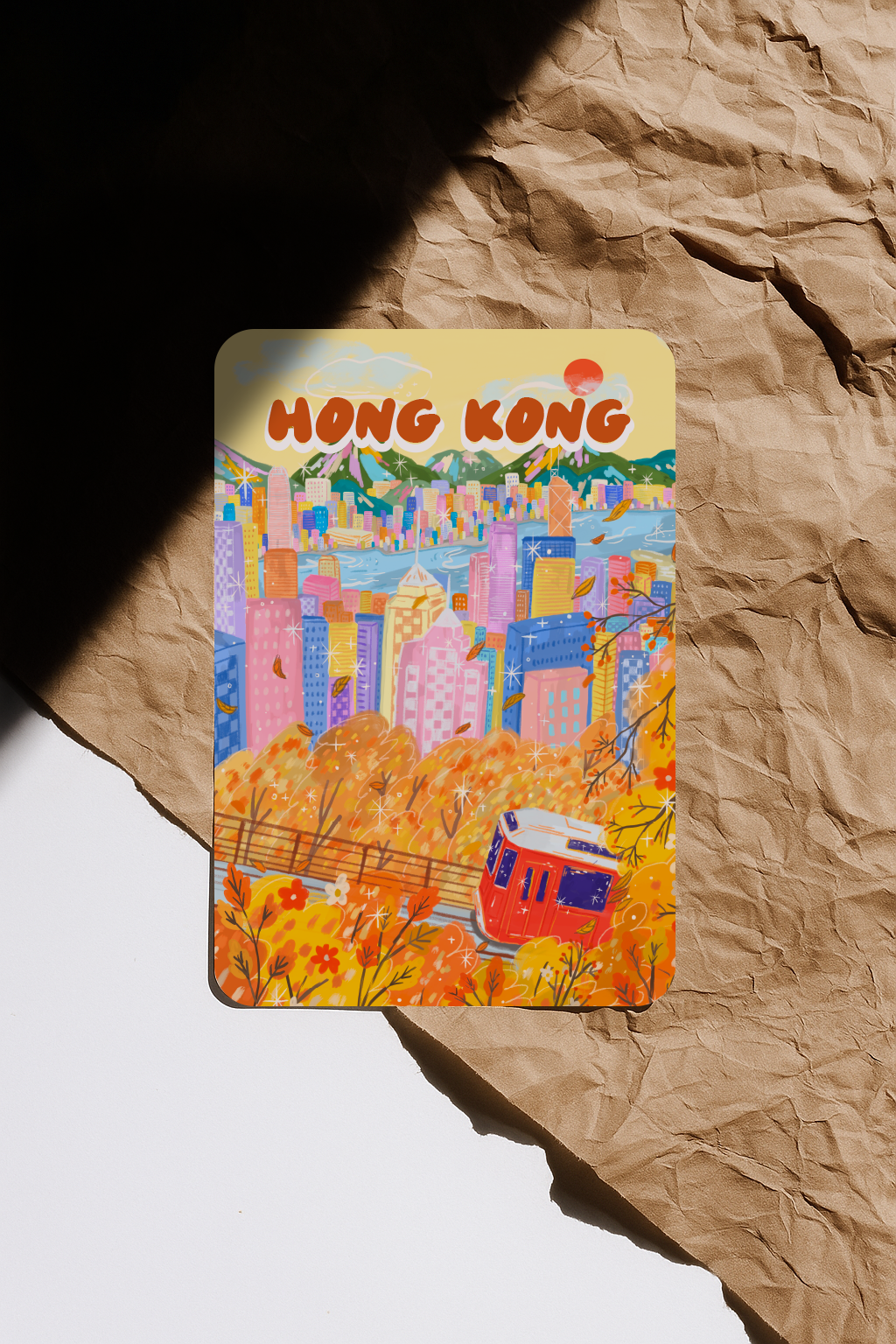 Colorful Hong Kong-themed card on crumpled brown paper
