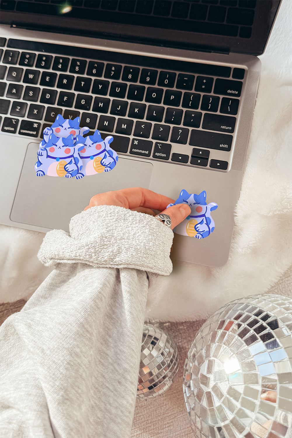 Blue harmony cat sticker on laptop with cozy blanket, peaceful Maneki-neko waterproof vinyl"