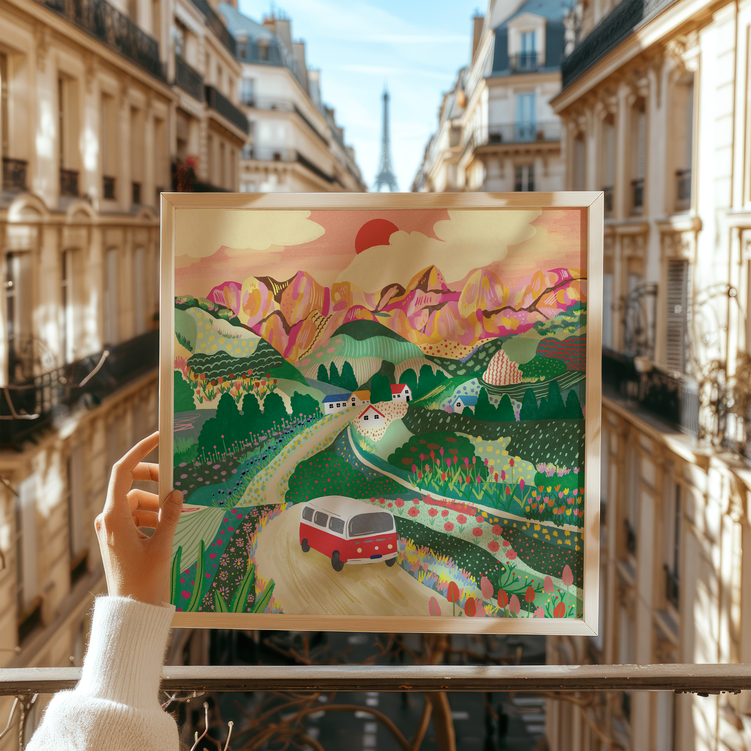 Let's Go On A Trip colourful campervan landscape art print held up in Paris street by Ziyi Studio London