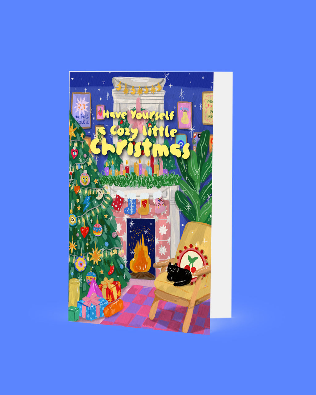 Christmas card with a fireplace, tree, and cat on a blue background