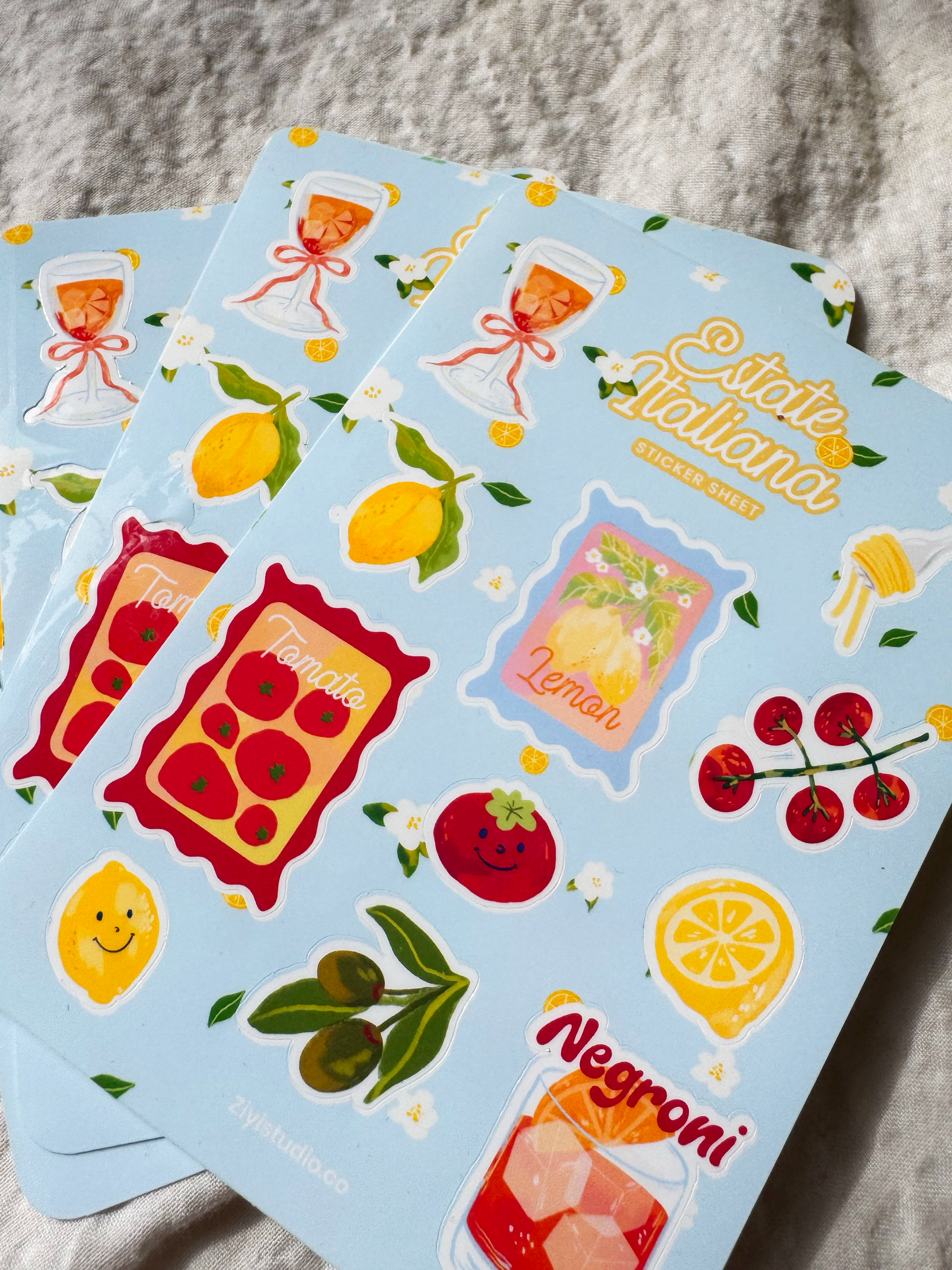 Italian summer-themed sticker sheet featuring hand-drawn illustrations of lemons, tomatoes, Aperol spritz, Negroni, pasta, and olives on a blue background.
