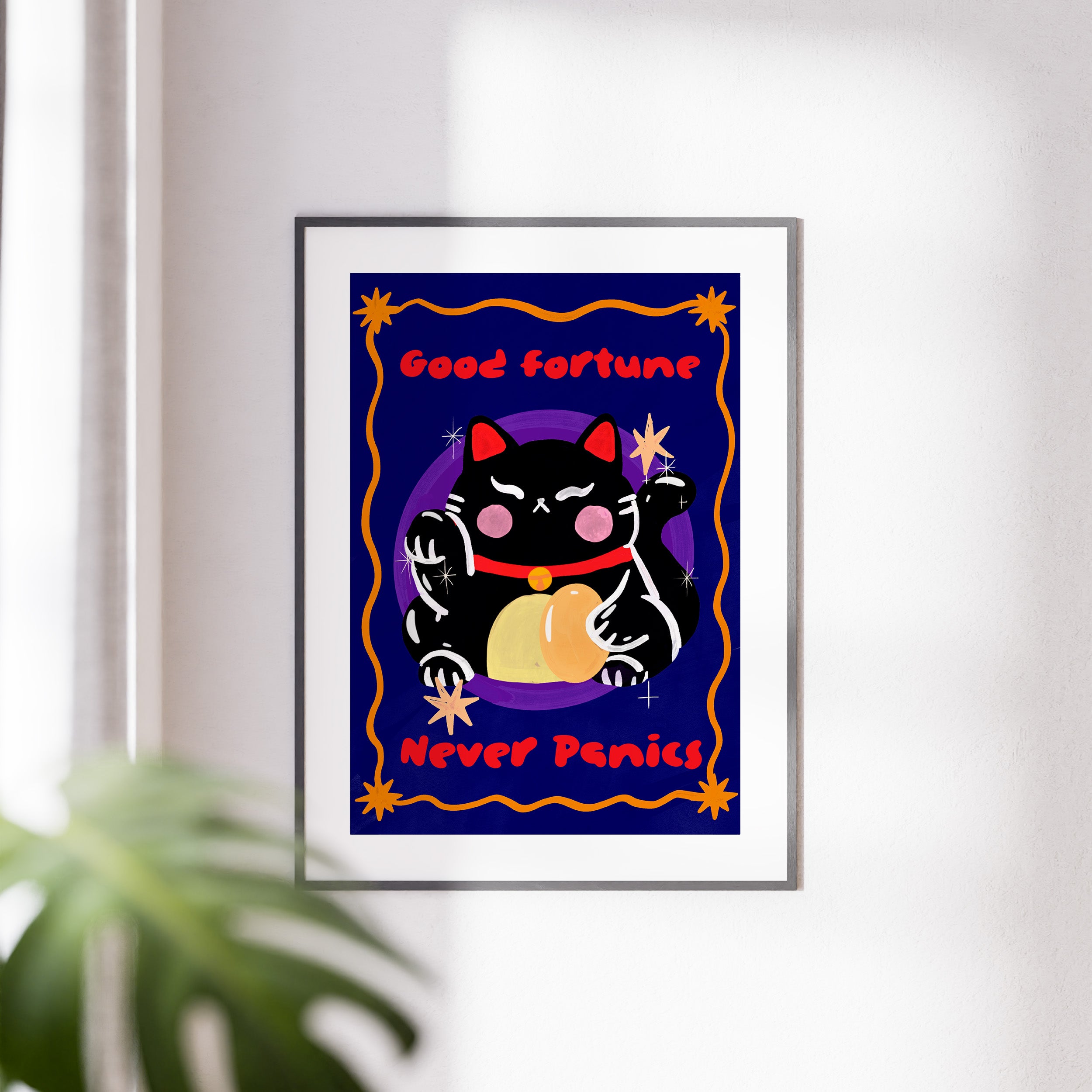 Framed artwork with a black cat illustration and text on a blue background