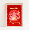 Framed poster with a cartoon character and text 'Keep the Energy Moving' on a red background.
