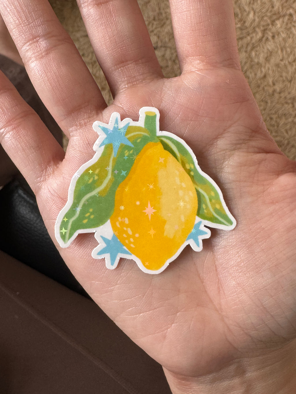 Glossy sparkly vinyl lemon sticker with hand-drawn illustration. Cute and zesty, perfect for summer stationery or decorating bottles and planners.