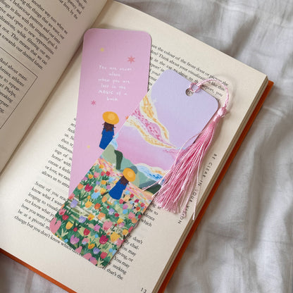 Handmade bookmark titled “Lost in Magic” with a dreamy illustration and the quote “You are never alone when you are lost in magic.” Double-sided design with matte finish and optional tassel.