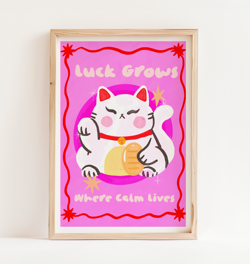 Framed artwork with a cartoon cat and text on a pink background