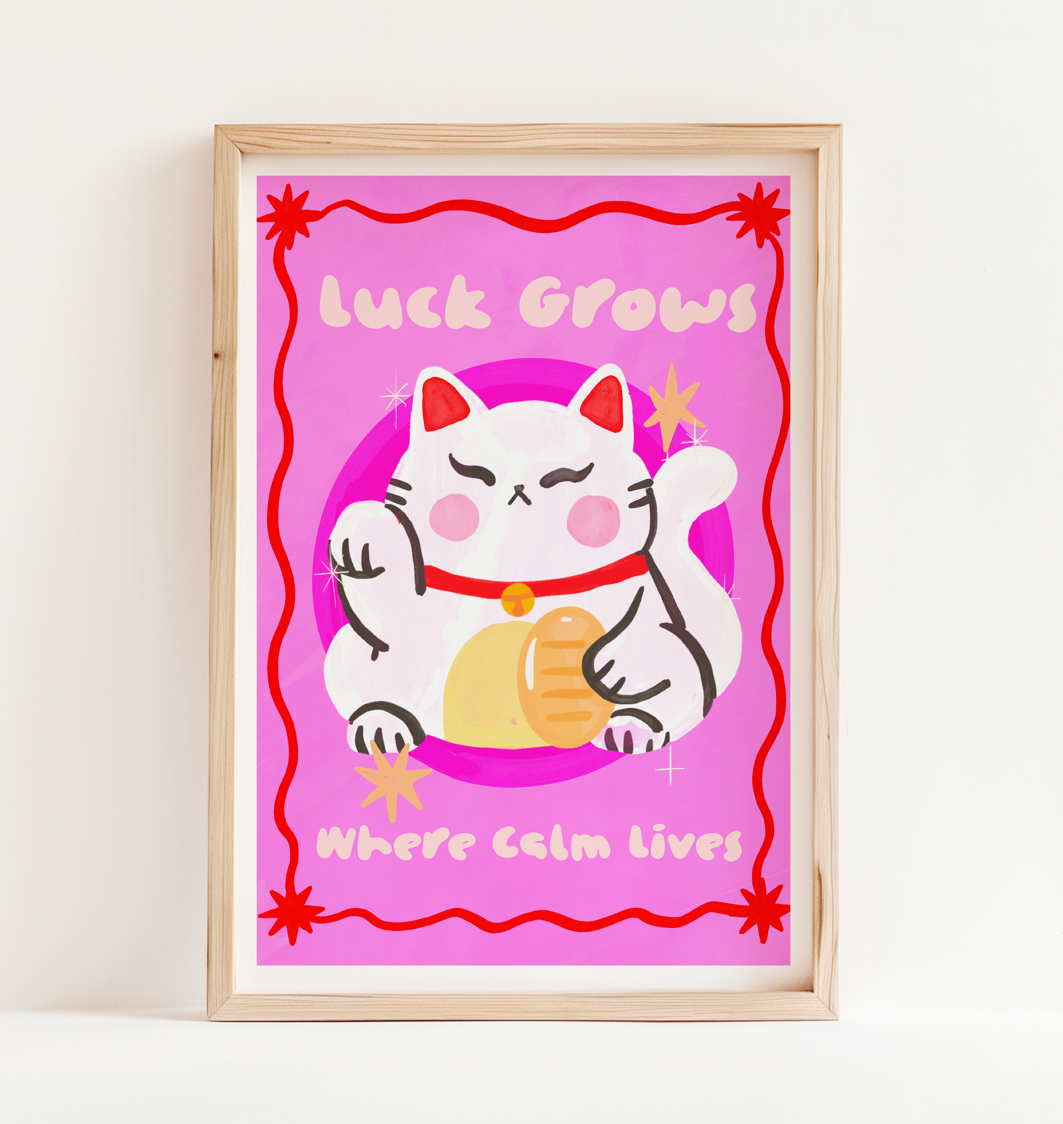 Framed artwork with a cartoon cat and text on a pink background
