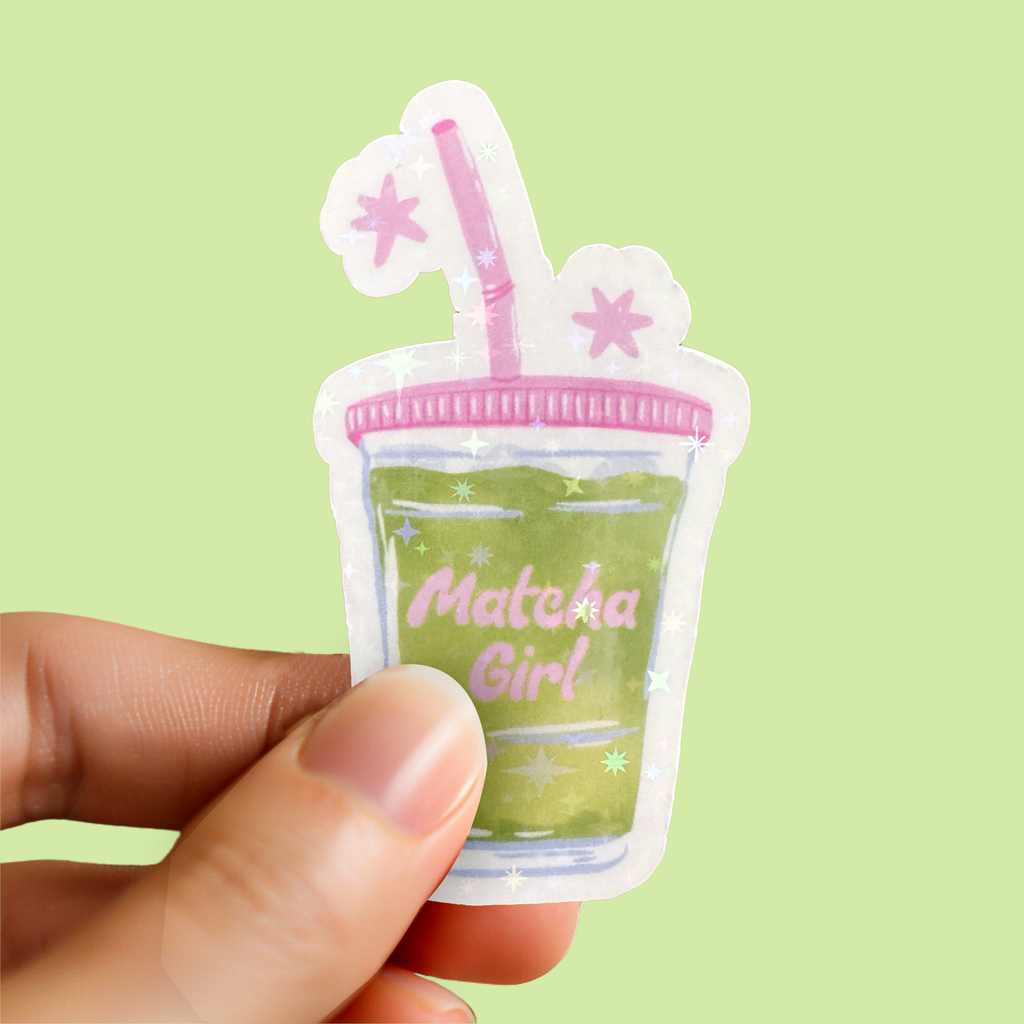 Matcha Girl sparkle vinyl sticker held by hand showing shimmering pastel finish