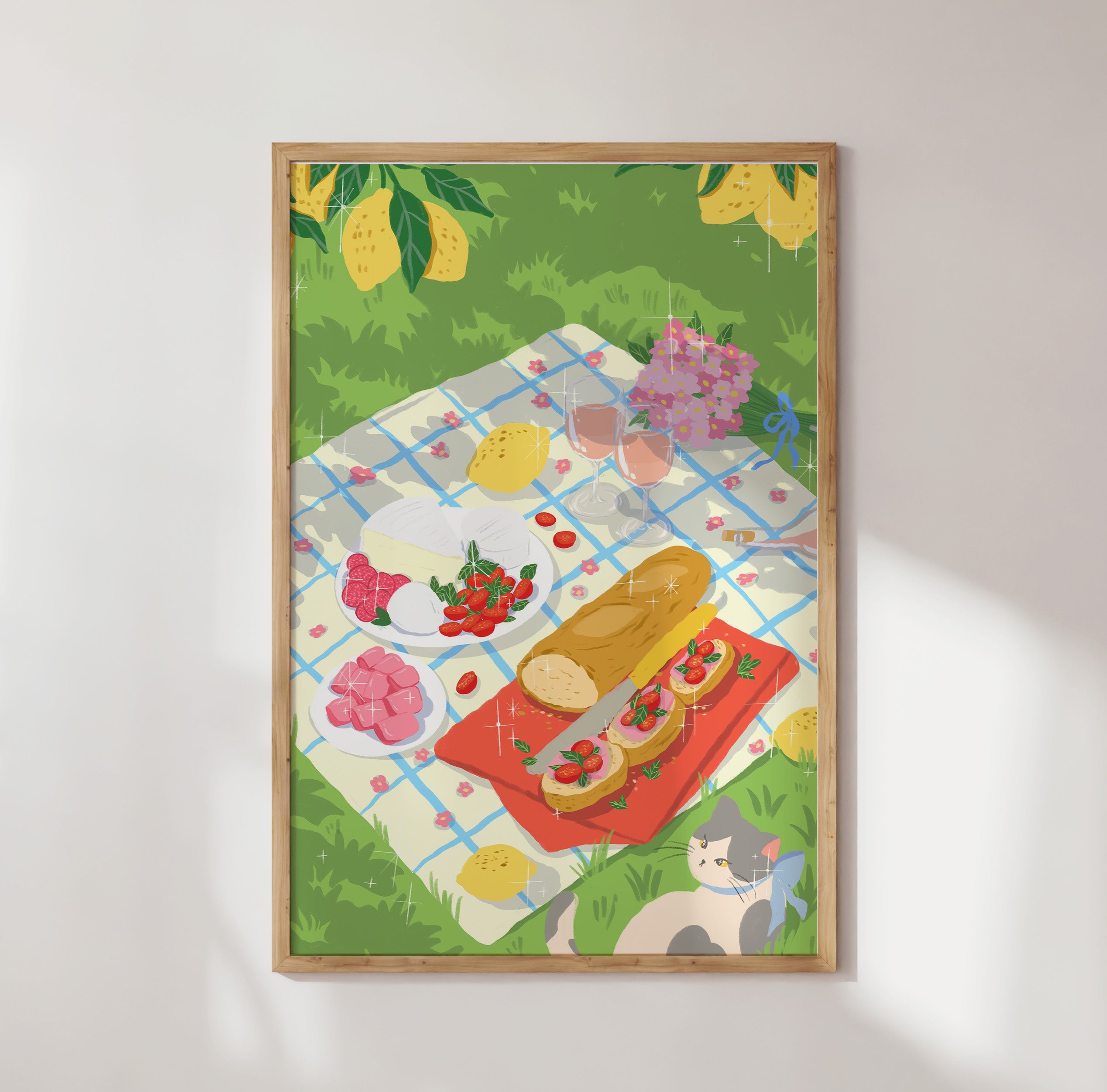 Art print of an Italian-style picnic under lemon trees featuring wine, cheese, tomatoes, and a cat resting in the grass. Bright summer garden vibe by Ziyi Studio.