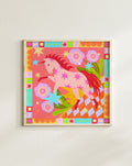 ink horse folk art print in natural wood frame on beige wall, featuring vibrant floral motifs and geometric decorative border