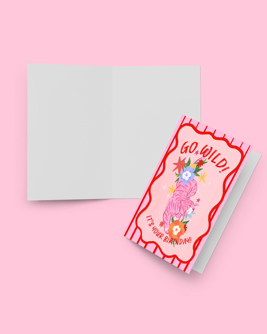 Greeting card with 'Go, Wild! It's Your Birthday!' text on a pink background