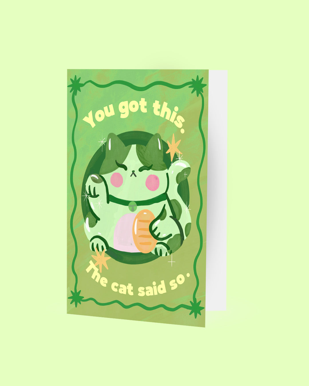 Card with a cartoon cat illustration and text on a green background