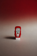 Handmade tomato ketchup clay brooch with hand-painted label detail by London artist Ziyi Studio"