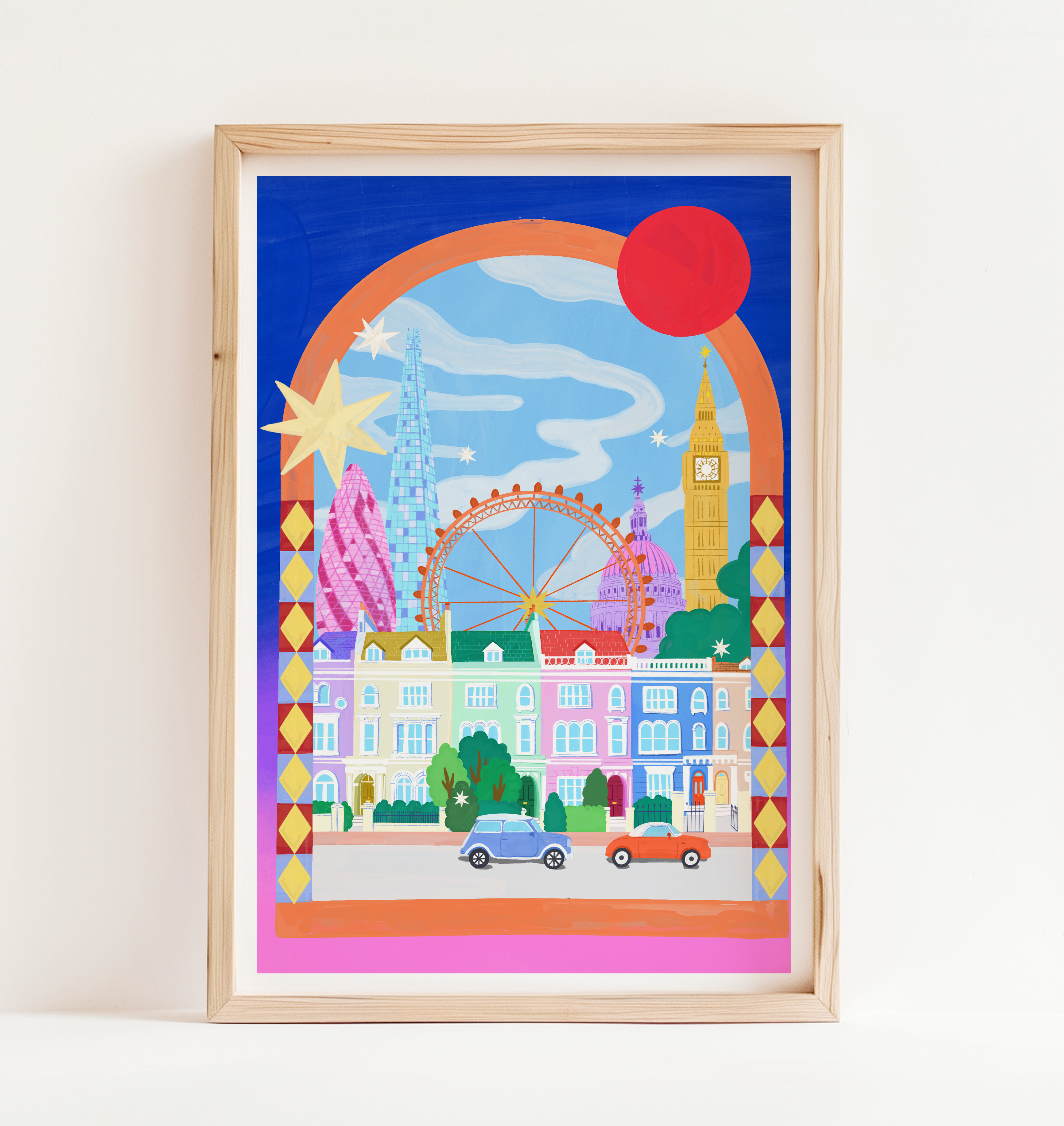 Framed colorful illustration of a cityscape with landmarks on a white wall.