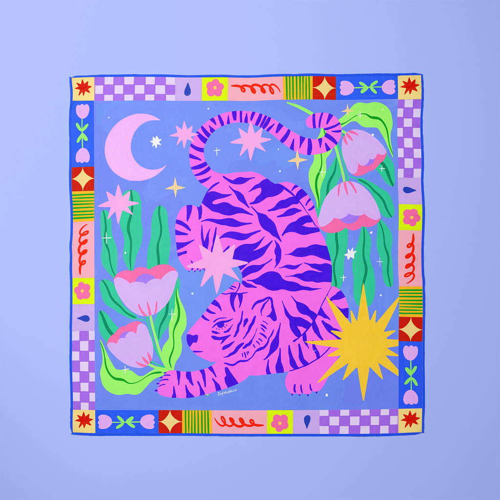 Colorful fabric square with a pink tiger design on a blue background